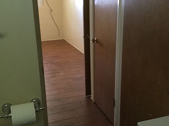 Bedroom and linen closet from bath