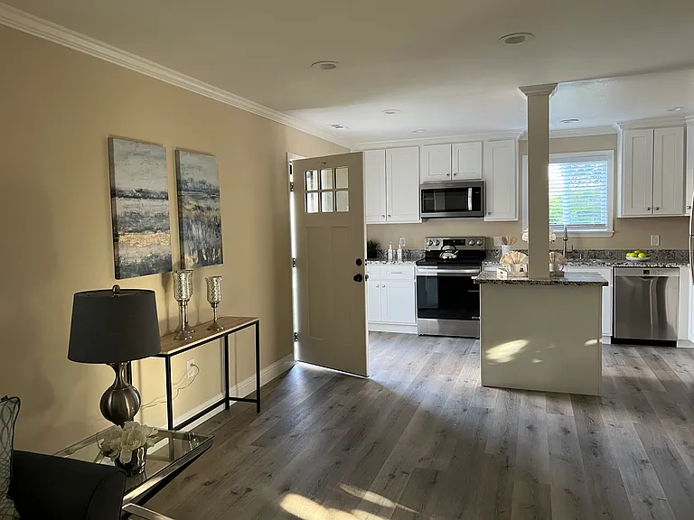 Part of living room shown with simulated furniture