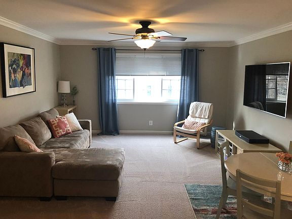 Brand new carpet and fresh neutral paint in living room. Plenty of natural light!