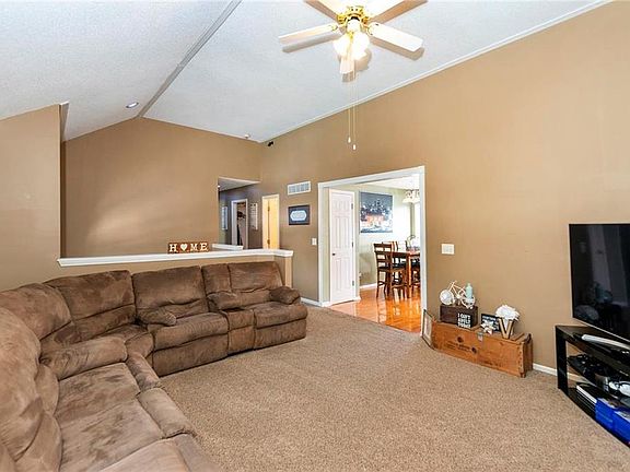 Main Floor Living Room with view to eat in Kitchen