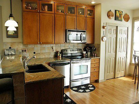 Dream kitchen w/slab granite & designer tile back splash.