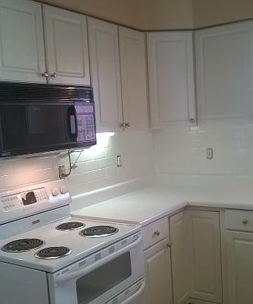 Kitchen with new tiled backsplash