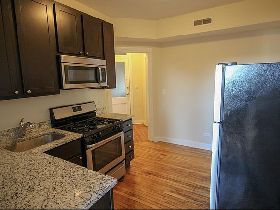 Kitchen has dine-in area for table