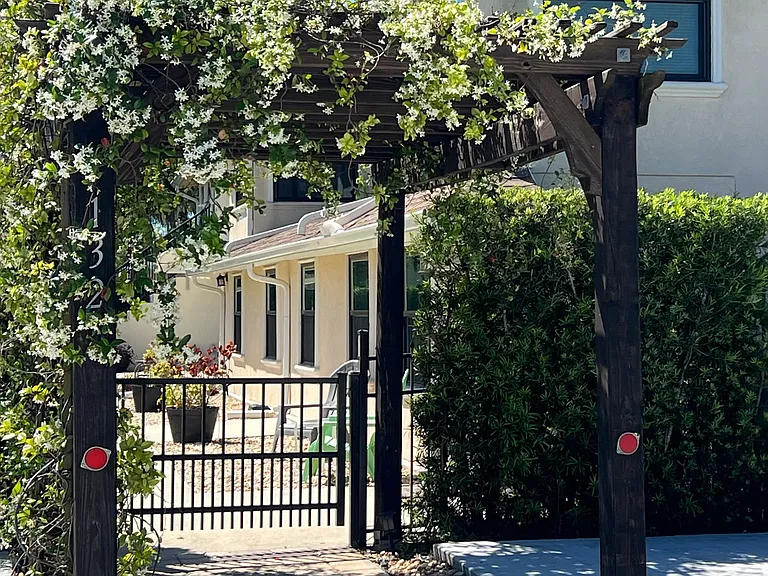 fenced entryway and entire yard