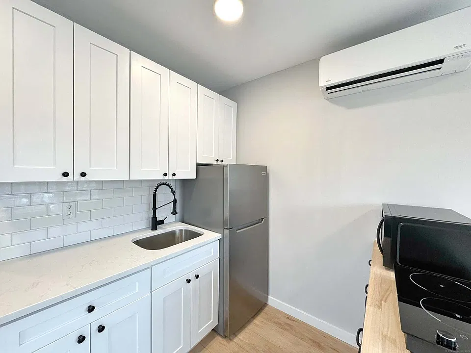 32 W Main St #203