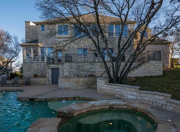 Backyard paradise with pool, hot tub, patios, kids' playhouse and large barbecue