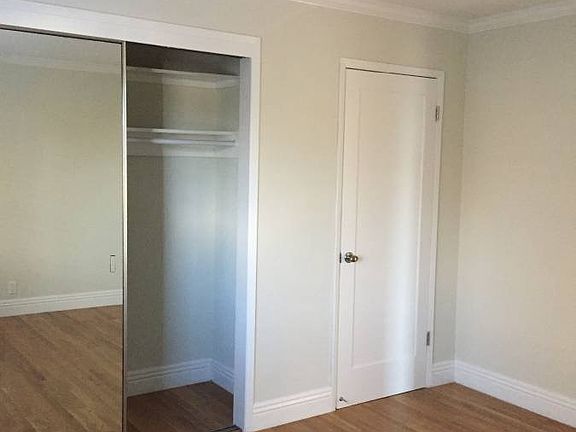large mirrored walk-in closet