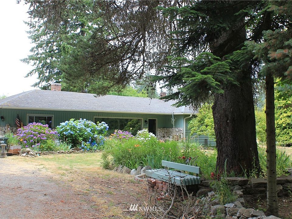 Little bit of cut back and this lush, mature landscaping with brighten up your yard next spring.  Large fir trees line the front, plenty of off-street parking, large front and back yard for entertaining.  Very peaceful
