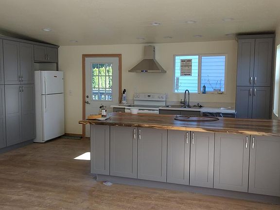 new remodeled kitchen with reclaimed wood island