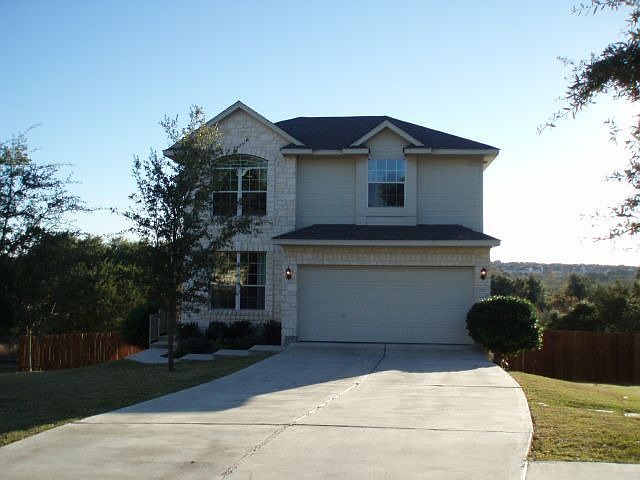 White stone home on cul-de-sac lot backing to greenbelt