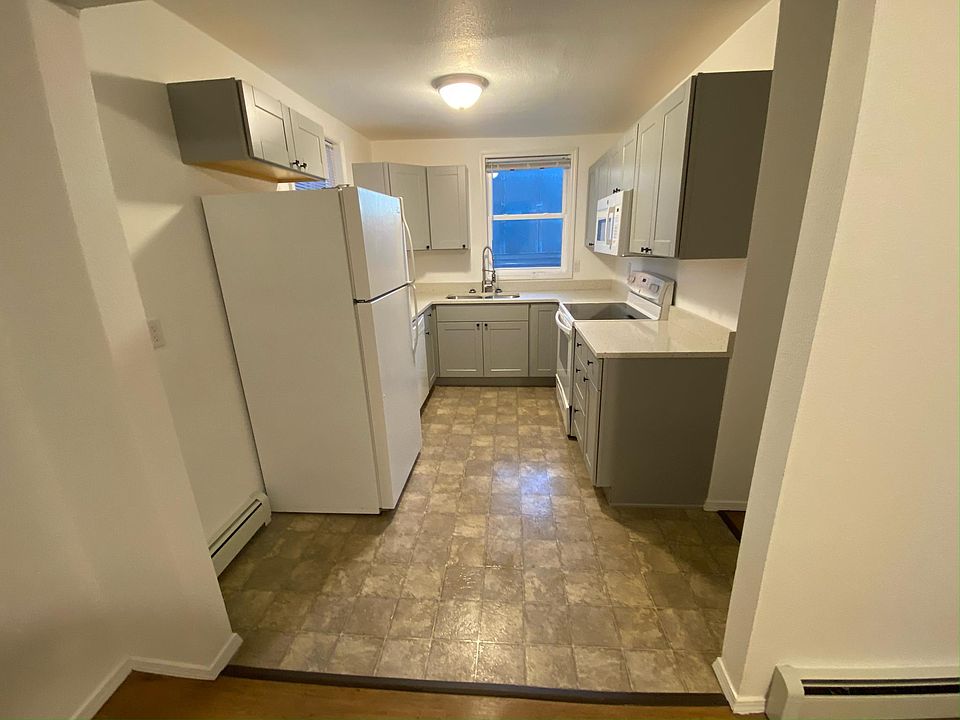 Newly remodeled kitchen with quartz countertops.