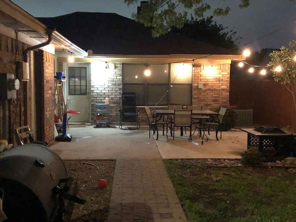 Backyard. Table, fire pit and smoker are display only, not provided