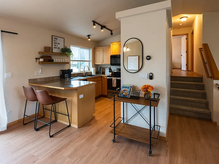 Kitchen - Large Pantry - Keurig and traditional coffee maker included. Hall leading to two bedrooms and bathrooms. Stairs are carpeted.