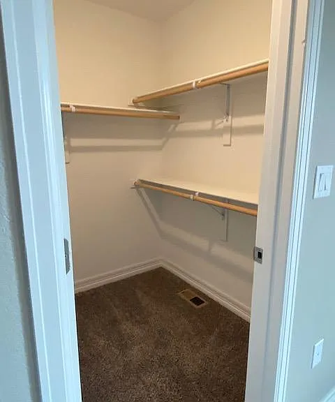 Walk in master bedroom closet
