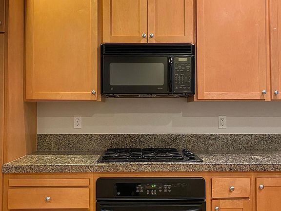 Gas stove and granite countertops.