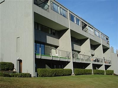 Spacious end unit with large entertainment size deck overlooks multiple fairways.