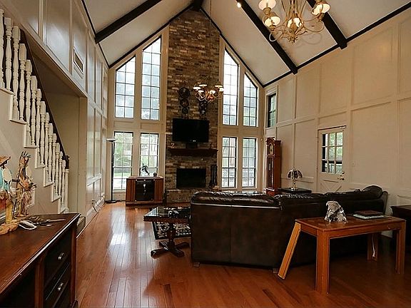 Notice the two story chimney and many windows looking out to the backyard.