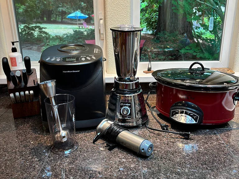 breadmaker, nice set of knives, blender, crock pot, stick blender
