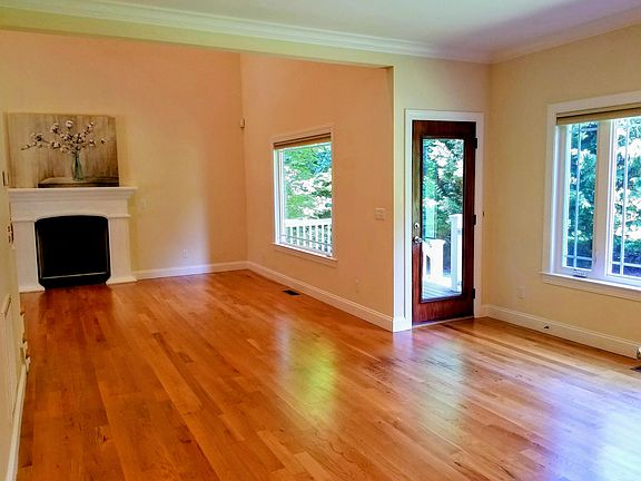 Living room to open concept dining and kitchen. Back door to porch and backyard