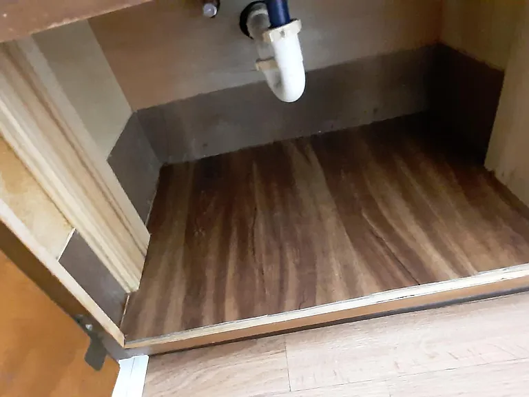 under bathroom sink...LVP