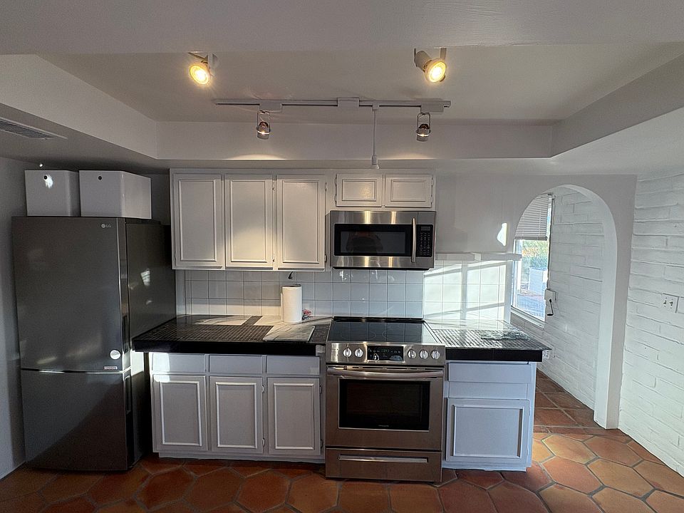 Kitchen with LG Fridge, new electric stove, and Bosch dishwasher