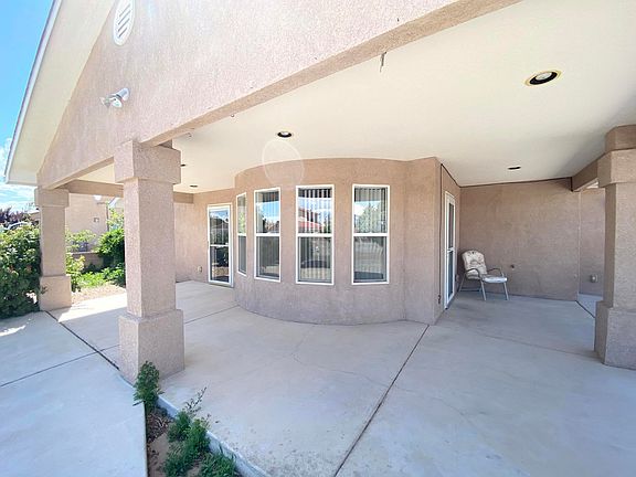 front porch, windows to turret shaped dining space