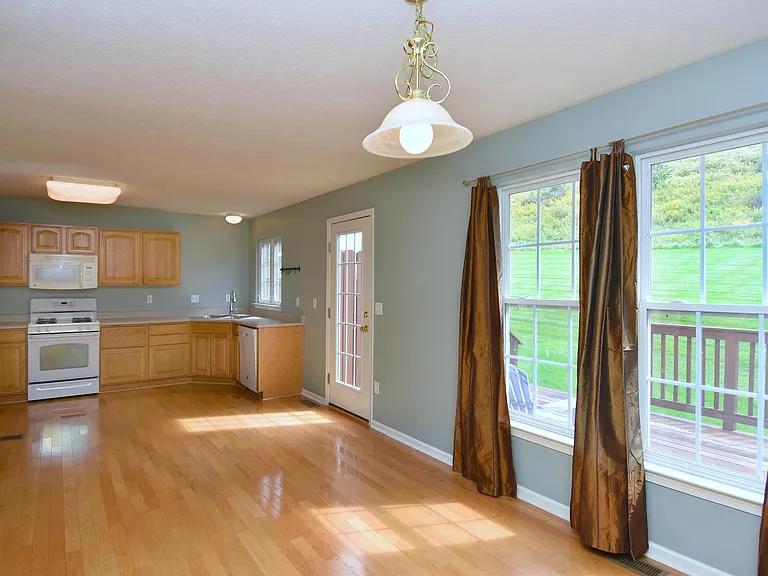 Beautiful dinning room with huge windows leading to a nice sized deck