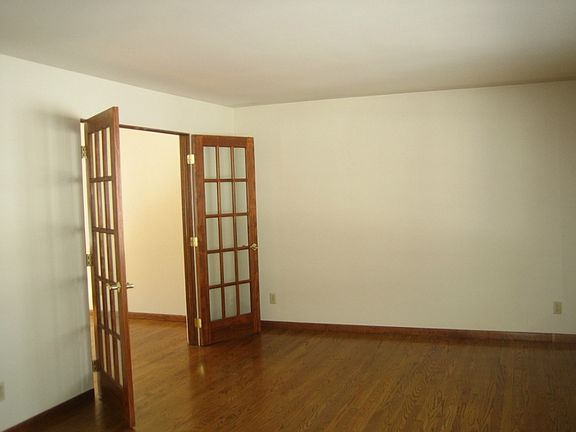 French doors in living room...note the wood floors.