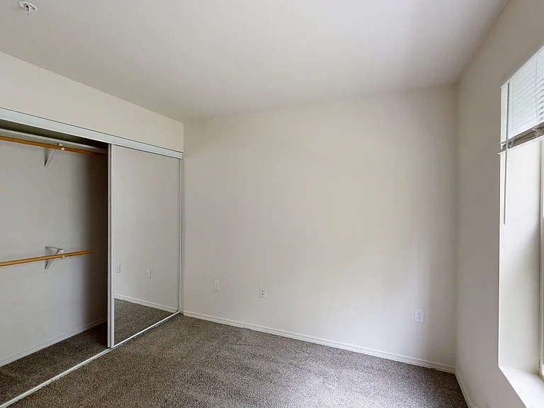 Spacious apartment Bedroom with Carpet Floor.