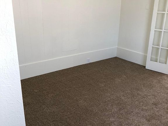 Large bedroom features adorable French doors