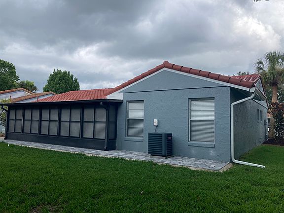 Backyard. View of rear master bedroom and Florida room