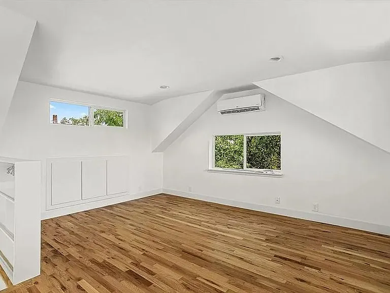 Upstairs loft space. Storage cabinets in back wall.