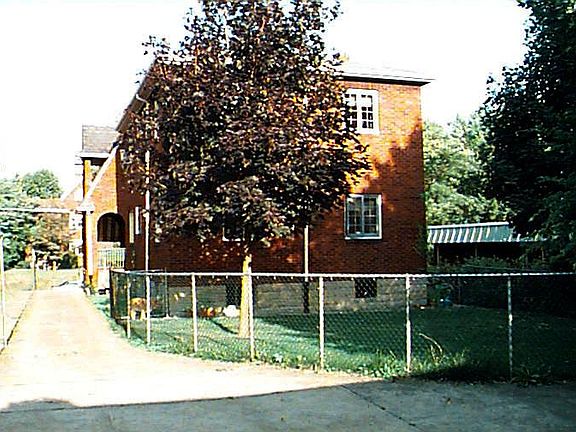 Backyard and parking spot on right