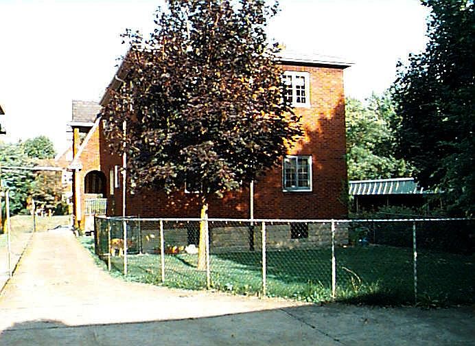 Backyard and parking spot on right