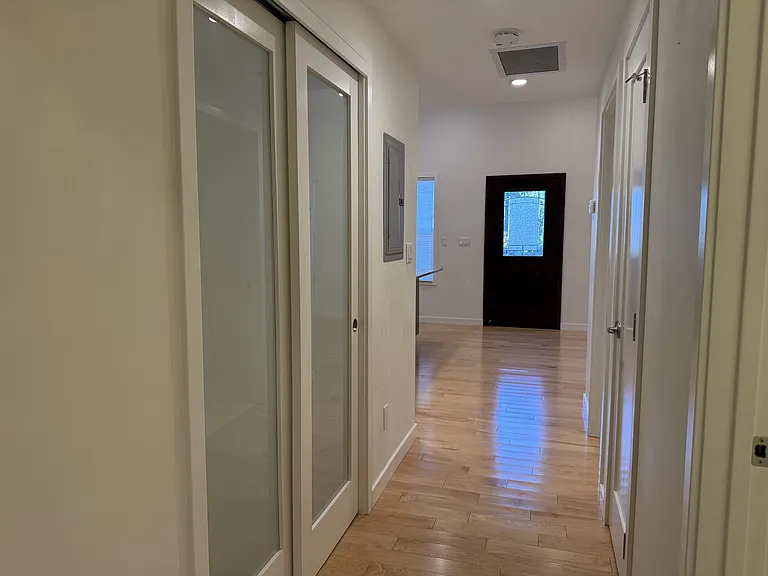 Hallway with 2 storage closets.