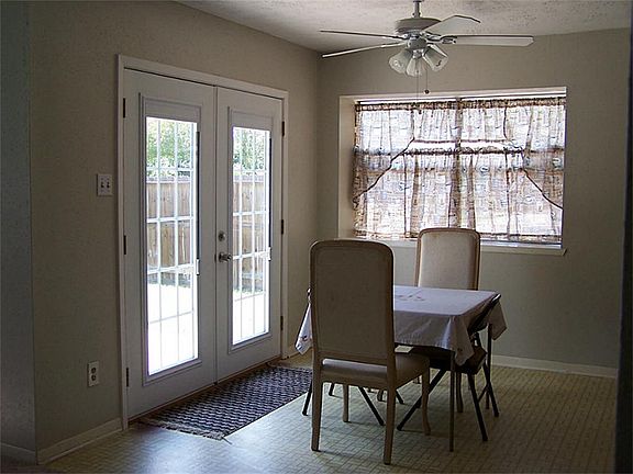 Cozy breakfast area next to the beautiful French doors opening into the backyard.