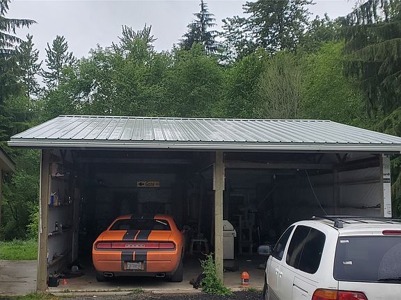 Detached double garage and shop area.>