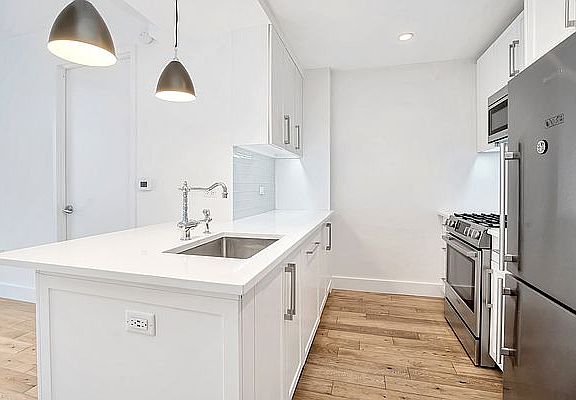 4th image of 27-21 44th Dr Unit 203