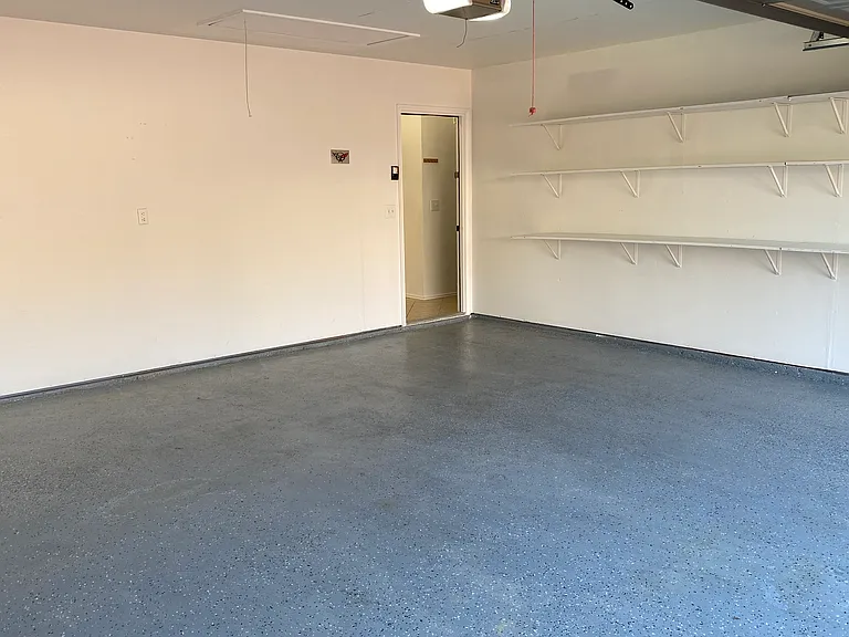 Garage with Epoxy Floor and Shelves for Extra Storage