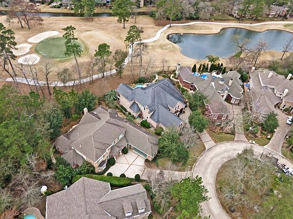 Located on a small CDS enclave in Grogan's Mill on the #1 green of The Woodlands Country  Club Tournament Course.