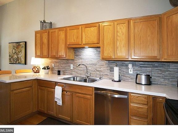 Large kitchen with newer quartz counters, backsplash and new appliances