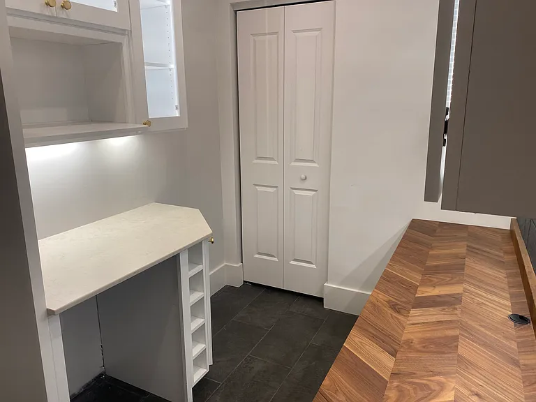 Finished basement, home office, walk-in storage.