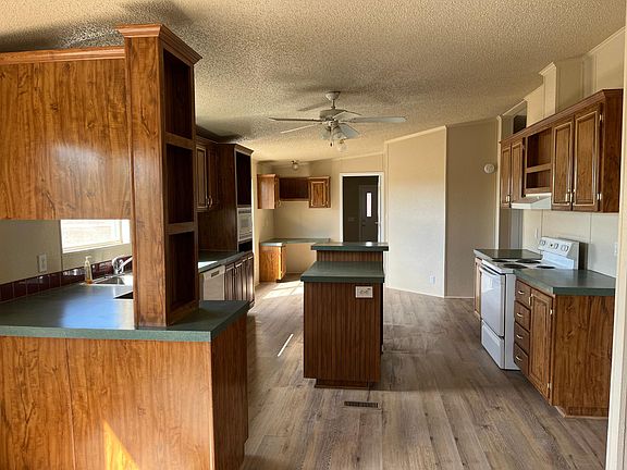 Kitchen view from the living room and front entrance
