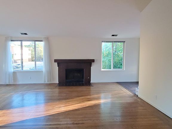 Fireplace and hardwood floors.