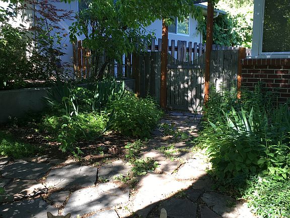 Side of front yard with gate