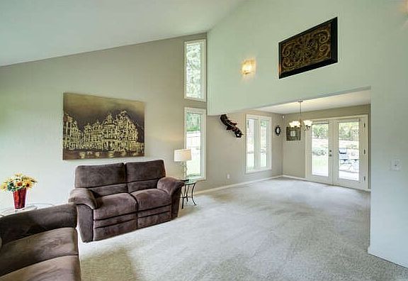 The vaulted ceiling in the foyer and living room create an open and airy atmosphere