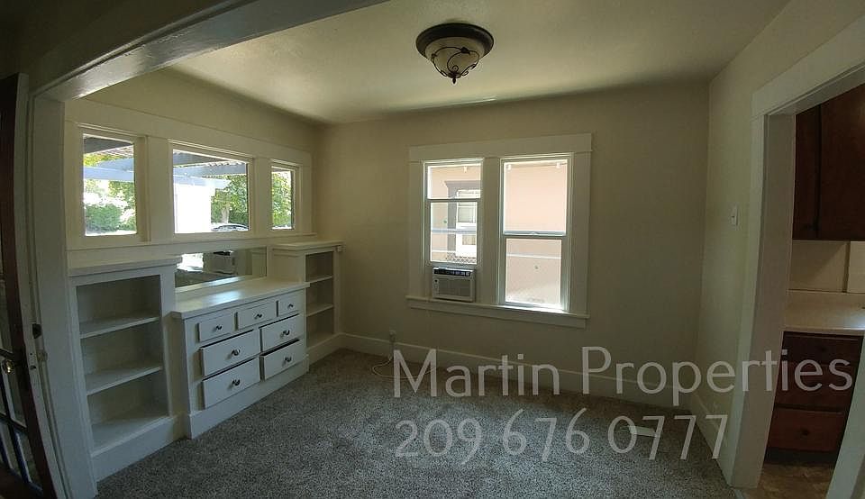 Formal dining area has built-in china cabinet.
