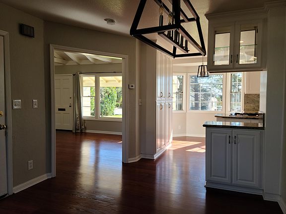 Dining Room with the kitchen and living room in the background.