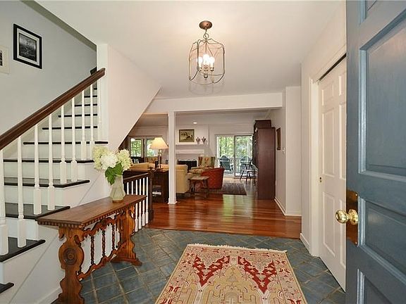 Very large tiled entry w/roomy coat closet & opens into the living areas of the home and stairs to side to 2nd floor.