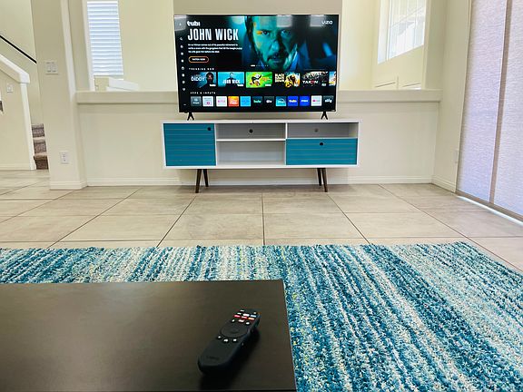 Kick back & relax in the fully-furnished living room while watching the new 65in Smart TV. WiFi enabled for all your favorite streaming.